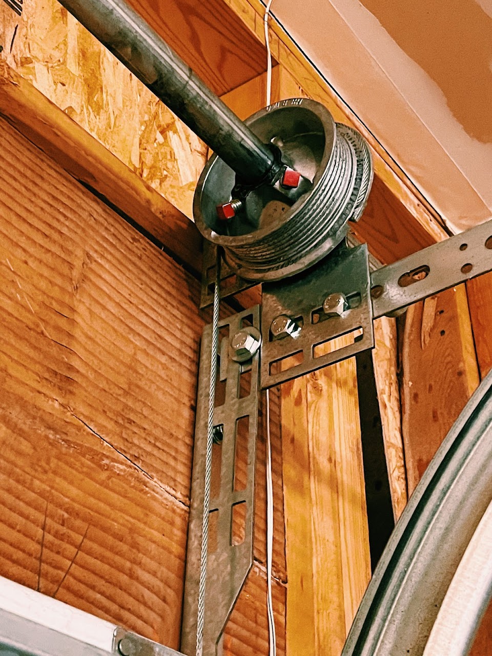 Close-up of garage door torsion spring mechanism