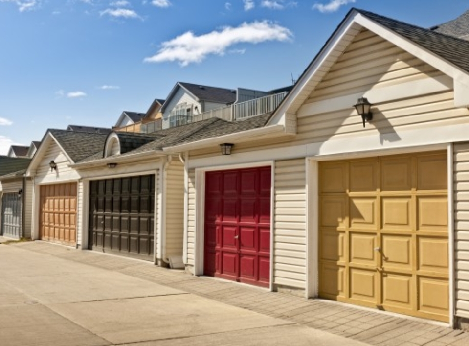 Row of matching residential garage doors on townhomes